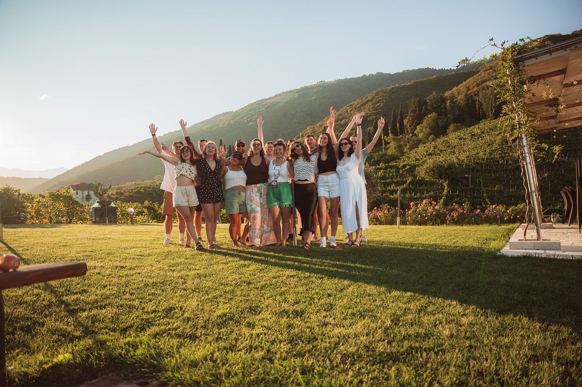 The Glowflexibleen team gathered outdoors at a New Zealand nature wellness program location